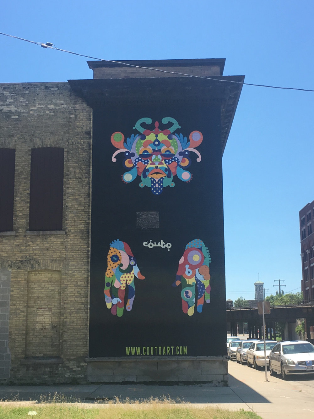 mural in Milwaukee by artist Couto Brothers.