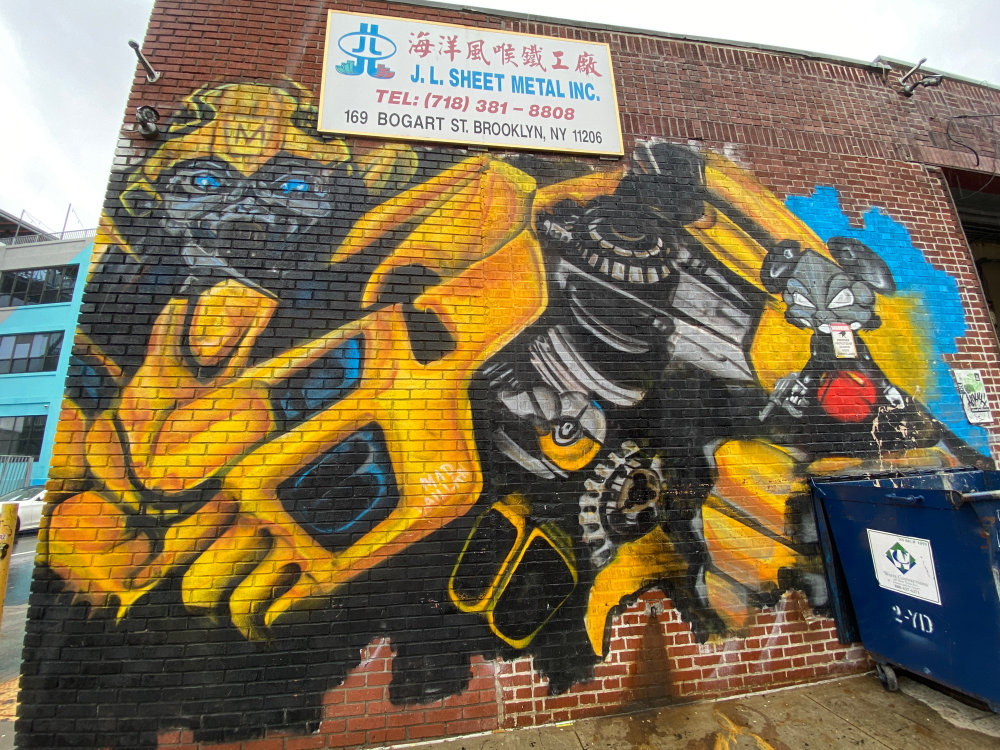 mural in Brooklyn by artist Mad Vaillan.