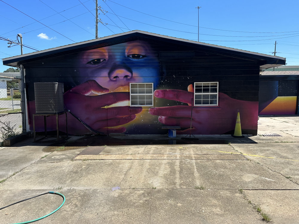 mural in Pensacola by artist unknown.